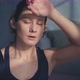Lady with Sweaty Face Rests Breathing Heavily After Training - VideoHive Item for Sale