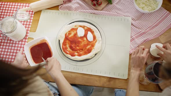 Top view video of prepare a homemade pizza. Shot with RED helium camera in 8K