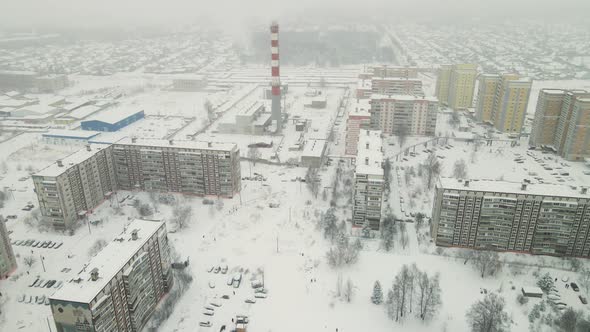 Snowcovered Sleeping Area of the City in Winter with Highrise Buildings