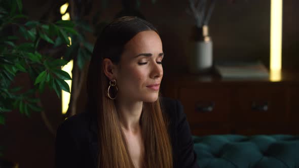 Successful Businesswoman Thinking on Couch in Office. Female Worker Looking Away