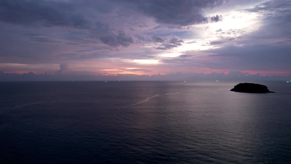 Purple Sunset with a View of the Sea and Clouds