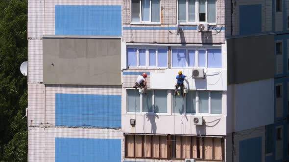 Two Industrial Climber, Insulation Facade of High-rise Building Using Styrofoam