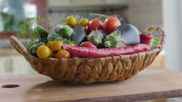 Basket Of Vegetables Is On the Table In Kitchen