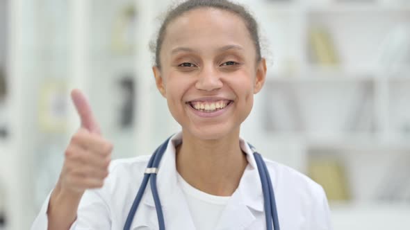 Portrait of Young African Doctor Showing Thumbs Up Sign