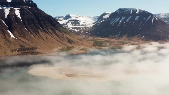 Drone Over Misty Fjord And Mountains