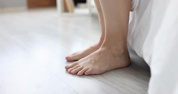 Morning Woman Gets Out of Bed Legs Go to Bedroom