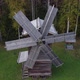Flying with a Drone Over a Traditional Wooden Windmill - VideoHive Item for Sale