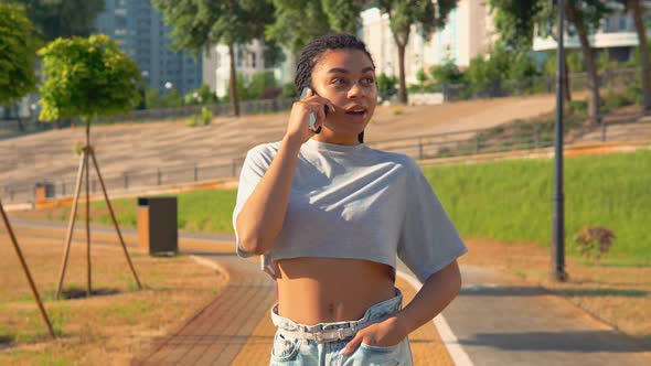 African American Woman Walks Talking By Phone Smiling Happy Lifestyle