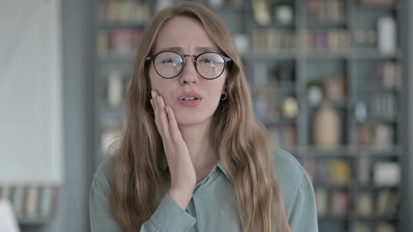 Portrait of Sick Woman Having Toothache in Office