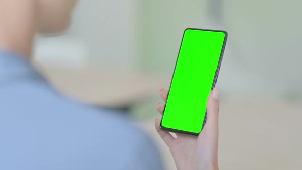 Woman Using Smartphone with Green Chroma Key Screen