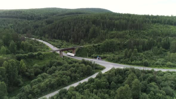 Aerial View of a Countryside Landscape with the Highway and Green Forest
