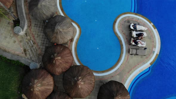 Hotel with a Swimming Pool with Beach Umbrellas Beds at Cancun Mexico