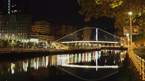 Night View at Arch Footbridge Across Nervion River in Bilbao, Spain, Timelapse