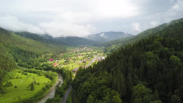 Aerial view of green Carpathian mountains covered with evergreen spruce pine foreston