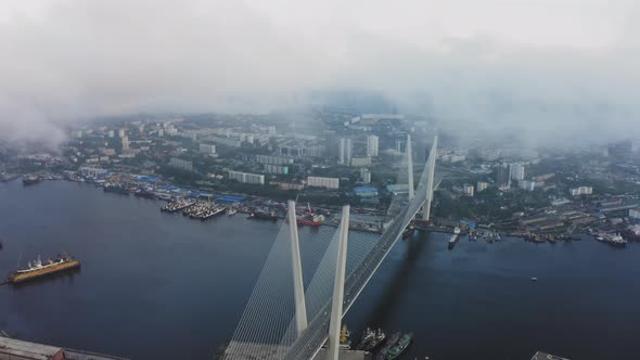 View From a Drone Vertically Down to the Golden Bridge and the City at Sunset