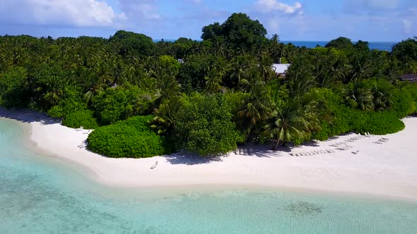 Aerial landscape of tropical shore beach by blue water with sand background