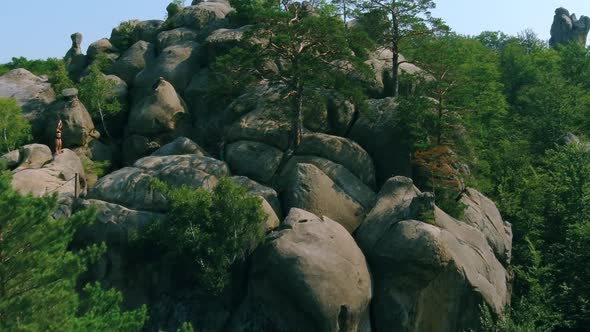 Beautiful Lady Doing Workout During Morning on Rock