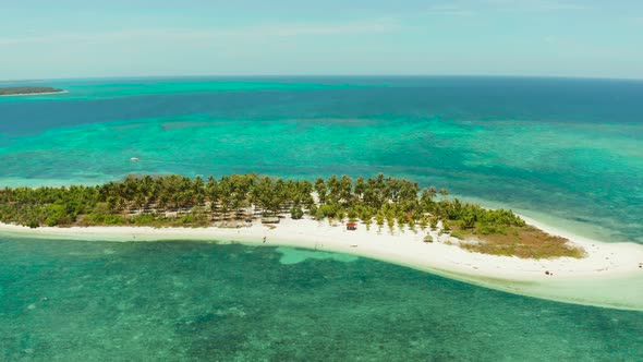 Travel Concept with a Sandy Beach and Blue Sea, Balabac, Palawan, Philippines