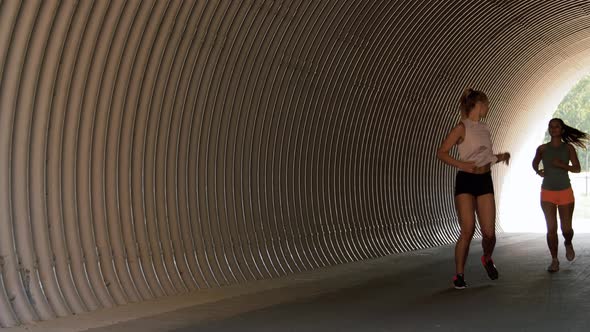 Young Women or Female Friends Running Outdoors