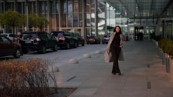 Successful Rich Woman is Walking in Business District Near Luxury Office or Living Building