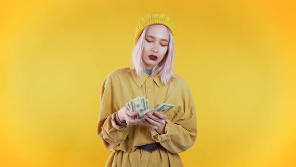 Satisfied Happy Excited Girl Counting US Currency. Woman Counts Money - Dollars