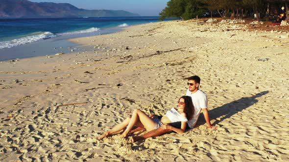 Happy Man and Woman in Love Dating on Vacation Live the Dream on Beach on Clean White Sand 