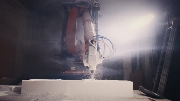Robotic Arm Cutting Plastic in Dark Workshop