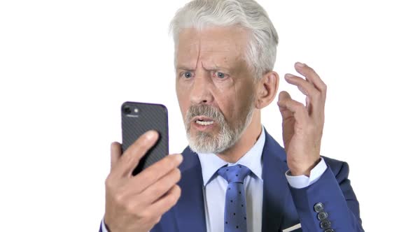 Old Businessman Upset By Loss on Smartphone White Background