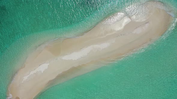 paradise sand beach, an empty sandbar, on the high tide in the azure seawaters. Mauritius