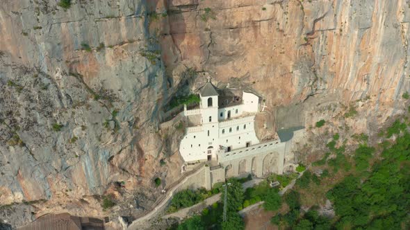 Aerial View on the Monastery of Ostrog Situated Vertical Rocky Mountain