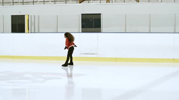 Little Athlete Skating on Indoor Ice Rink