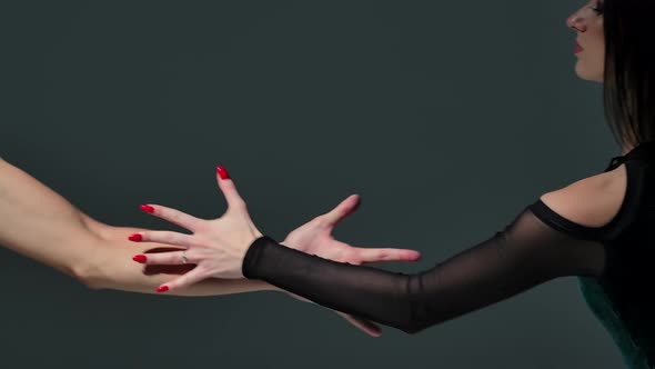 Close Up of a Man's and a Woman's Hands Touching Each Other's Fingers