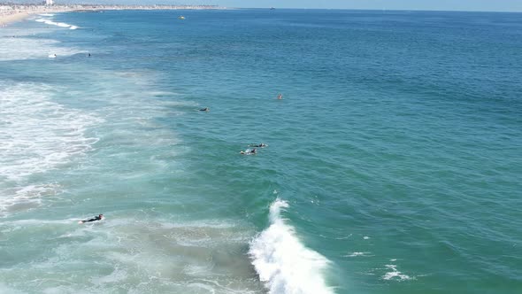 Surfers Paddle Out Aerial