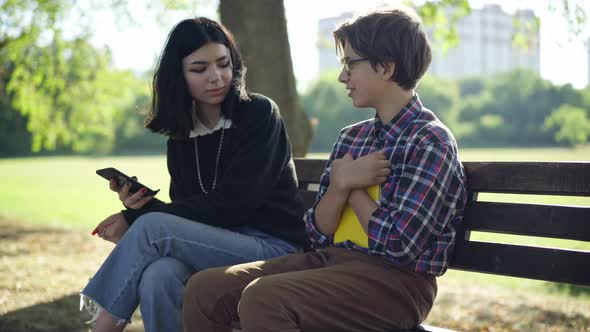 Shy Nerd Teenage Boy Talking to Girl Ignoring Classmate and Leaving with Smartphone