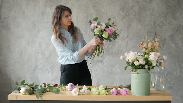 Florist at Work Pretty Young Blond Woman Holds Fashion Modern Bouquet of Different Flowers with