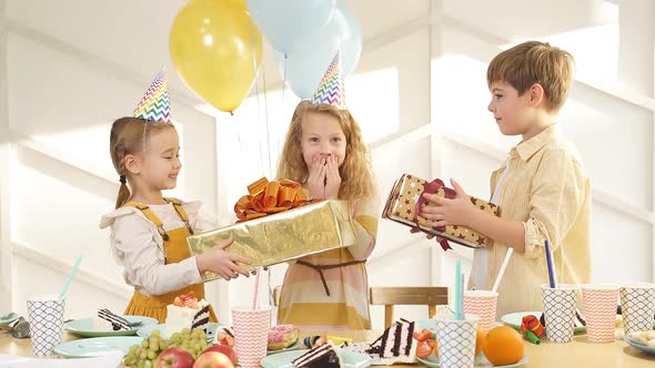 Adorable Child Girl Getting Gifts By Friends