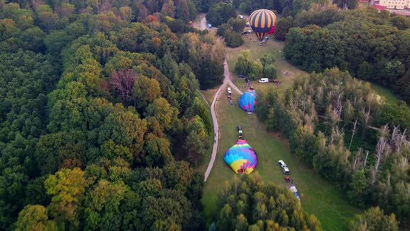 Hot Air Balloons Preparing for Takeoff From Park at Summer Sunrise Hyperlapse 