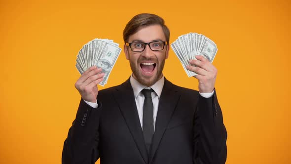 Excited Man Showing Bunch of Dollars, Successful Investment Project, Money