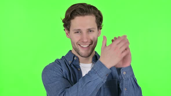 Excited Young Man Clapping and Cheering on Green Chroma Key