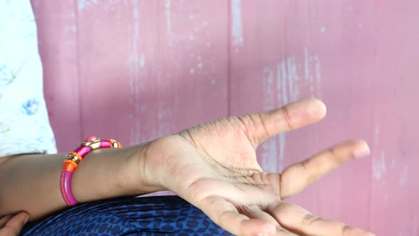 Young Woman Meditating in the Lotus Pose.