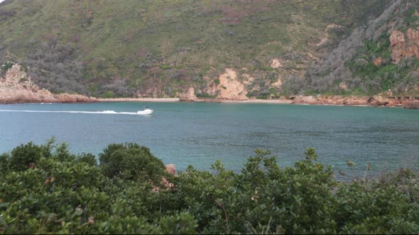 A beautiful summers day overlooking the Knysna HEads from a viewpoint with boats coming in and out o