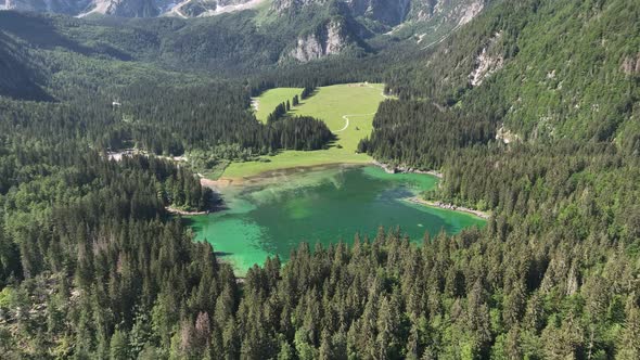 Emerald lake at Fusine with Mangart mountain