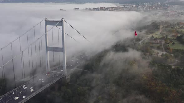 aerial video of Fatih Sultan Mehmet Bridge on a foggy day in Istanbul, Turkey