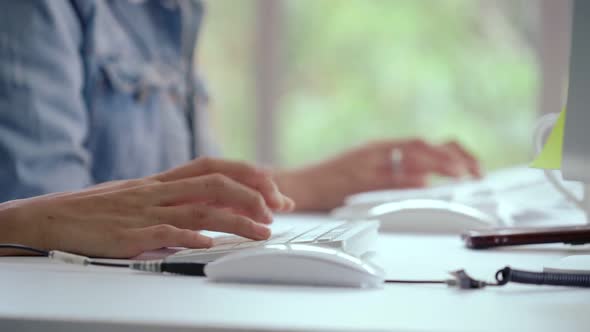 Close Up Shot of Businesswoman Hand Typing and Working on Computer on Desk