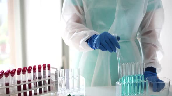 Closeup of a Laboratory Assistant Registers the Results of PCR Tests in Medical Laboratore During