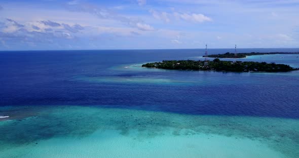 Beautiful flying copy space shot of a white paradise beach and blue sea background in best quality 