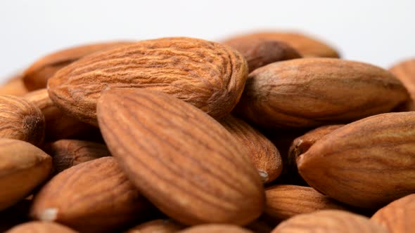 Almonds rotating close-up on white background