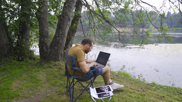 Successful businessman working in nature.