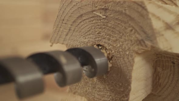 Drilling a Hole in a Wooden Bar