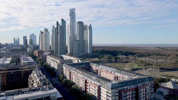 Aerial cityscape with modern residential and business district in Buenos Aires. Dolly in